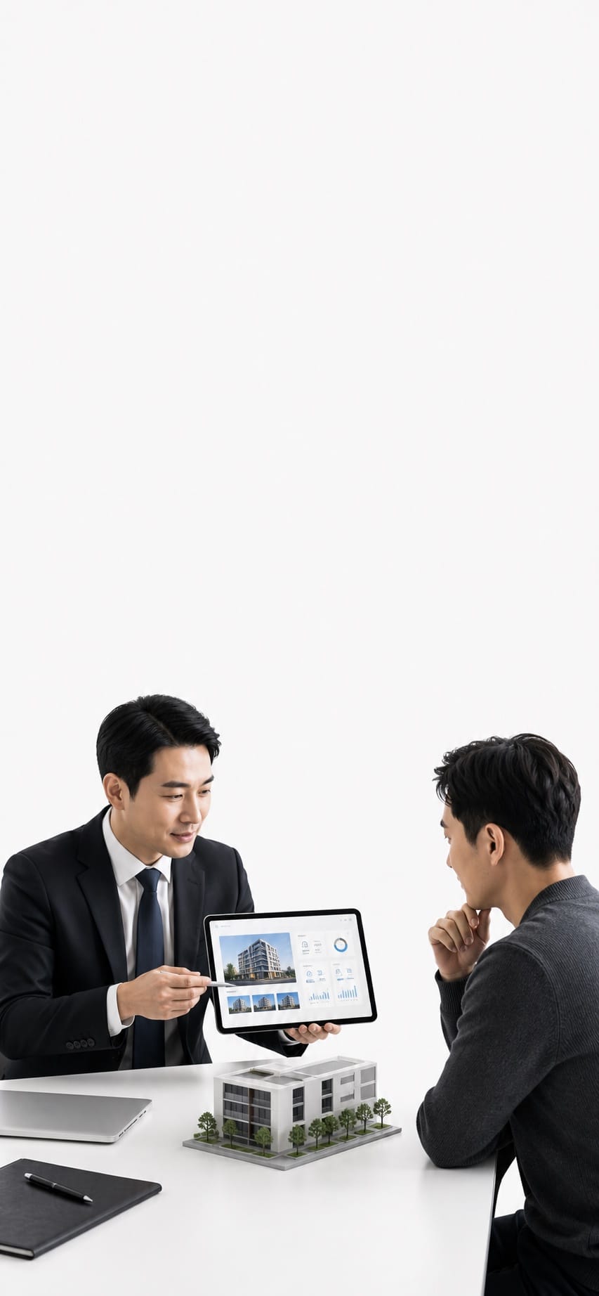 Property service advisor presenting a building portfolio with a small architectural model in a white studio.